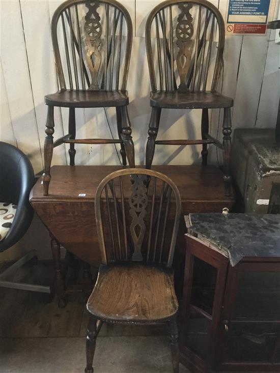 An oak gateleg table and 3 Windsor wheelback chairs